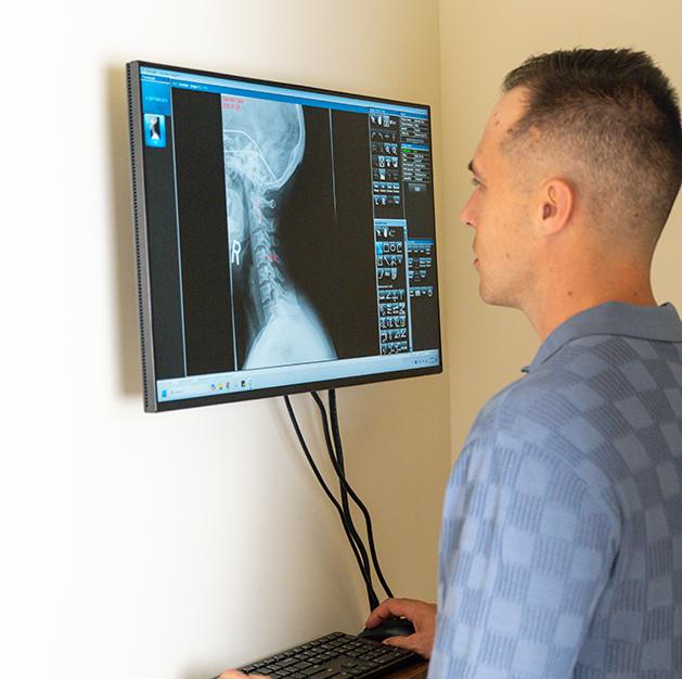 posture-correction-service-elevate-chiro-and-health-delreay-beach-florida Posture correction service at Elevate Chiro & Health in Delray Beach, FL.